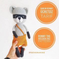 ronny the raccoon wears orange pants, black legs, black sleeves crochet pattern