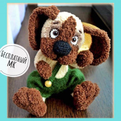 white dog, brown ears, brown muzzle, black nose, green overalls, crochet pattern