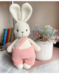 white rabbit wearing pink overalls crochet pattern