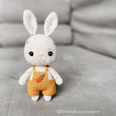 white rabbit wearing yellow and orange overalls free crochet pattern