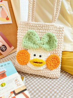Handbag decorated with orange cheeks, yellow beak, blue bow, crochet pattern