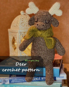 deer crochet pattern, deer, white horns, wearing a moss green scarf.