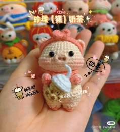 pig wearing pink bow holding milk tea cup, crochet pattern