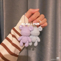 White and purple crochet pattern bear keychain