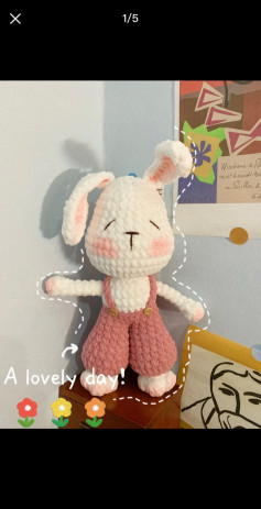 White rabbit wearing crochet pattern overalls