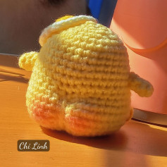Crochet pattern for a chick wearing a big butt egg hat