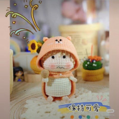 Crochet pattern for a doll wearing a bear hat.