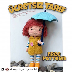 Gri eşarp sarılı bebek tığ işi modeli.uzun kırmızı bir elbise giy.