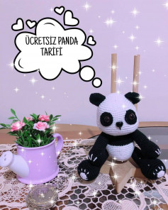 Oturan panda tığ işi modeli.siyah yüz, uzuvlar, kulaklar.