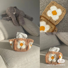Square crochet pattern with white four-petaled flower.