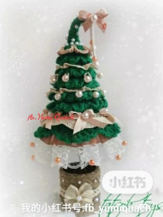 Christmas tree crochet pattern tied with a bow at the top
