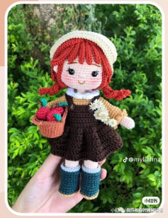 Crochet pattern for a red-haired doll wearing a black dress
