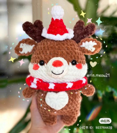 Crochet pattern of a deer wearing a Christmas hat