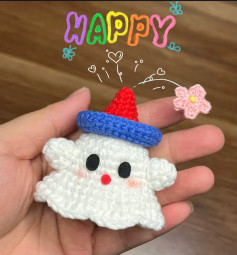 Crochet pattern of a ghost wearing a birthday hat.