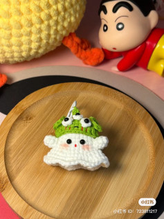 Crochet pattern of a ghost wearing a three-eyed monster hat
