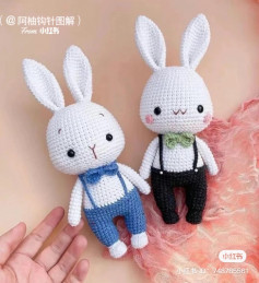 White rabbit crochet pattern wearing overalls