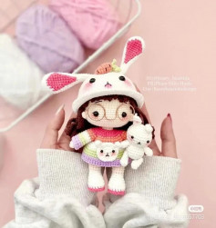 Crochet pattern for a doll wearing a bunny outfit