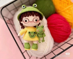 Crochet pattern for a little girl doll wearing a frog hat