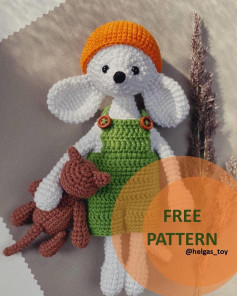Crochet pattern for a dog wearing an orange hat and blue dress.