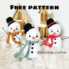 Crochet pattern for a snowman wearing a hat and a scarf