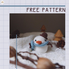 Crochet pattern for a snowman wearing a scarf and hat