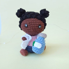 Crochet pattern for little girl holding a milk bottle