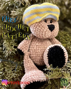 Crochet pattern of a brown bear wearing a hat