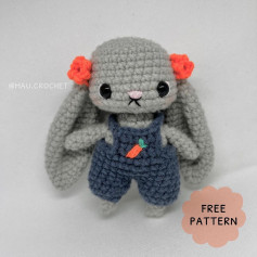 Gray rabbit crochet pattern wearing overalls