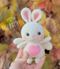 White rabbit crochet pattern with pink heart.