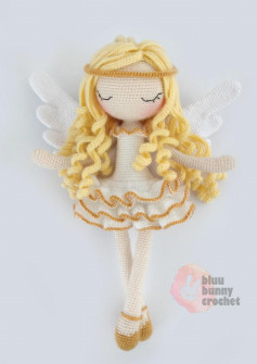 Angel doll with yellow hair and white wings