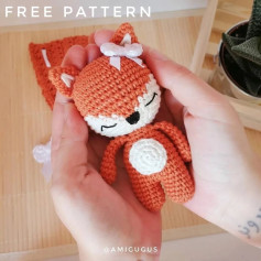 crochet pattern of a fox wearing a bow