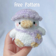 Crochet pattern for a duck wearing a hat and carrying a briefcase