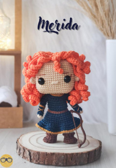 merida doll, Crochet pattern for a doll with curly hair wearing a dress and holding a bow