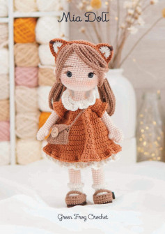 Mia Doll , Crochet pattern for a little girl with brown hair and a brown dress