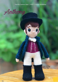 anthony boy doll wearing a hat, and a coat