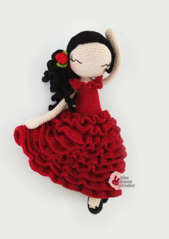 Crochet pattern for a girl doll wearing a red dress and black hair
