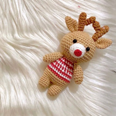 Crochet pattern of a deer wearing a red striped shirt