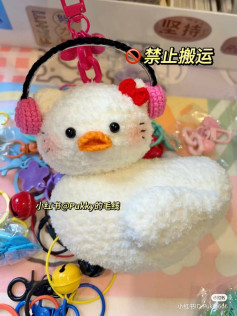 Duck crochet pattern wearing headphones and bow tie