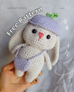 White rabbit crochet pattern wearing a hat and crossbody bag