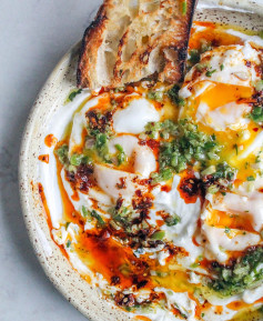 A little reminder to make these Turkish eggs: this version adds a tangy green sauce that’s drizzled over the traditional garlic yogurt poached eggs and buttery chili oil.