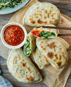 Chinese chive pockets/dumplings 韭菜盒子 with crispy, chewy crust & a flavorful filling.