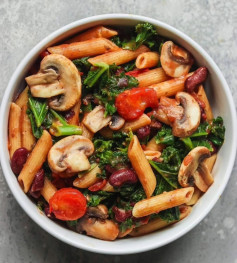 Creamy tomato pasta with mushrooms and kale