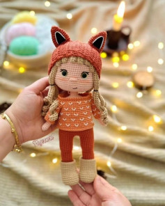 Crochet pattern for a doll wearing a fox-eared hat