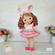 Crochet pattern for a doll wearing a pink dress and bunny ears