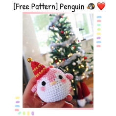 Crochet pattern for a penguin keychain wearing a Santa hat