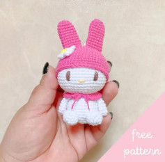 Crochet pattern for a rabbit wearing a pink hat