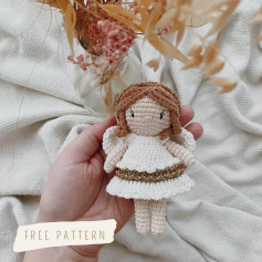 Crochet pattern for an angel doll wearing a white dress