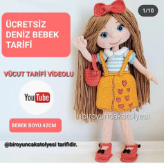 Elbise giyen bebek için tığ işi modeli