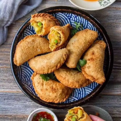 Karipap - a popular Southeast Asian snack that are filled with a thick curry potato filling & then deep-fried for that crunchy layer.