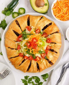 This Crescent Taco Ring is a must-make! Seasoned taco meat is wrapped in crescent roll dough and baked for a simple and easy appetizer or dinner.⁠